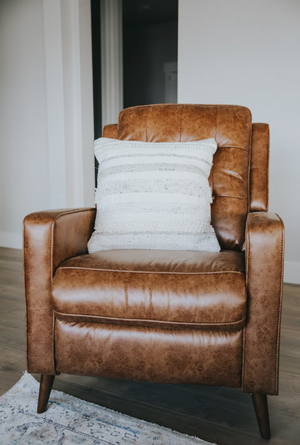 Your leather chair should be brown and should include an ottoman