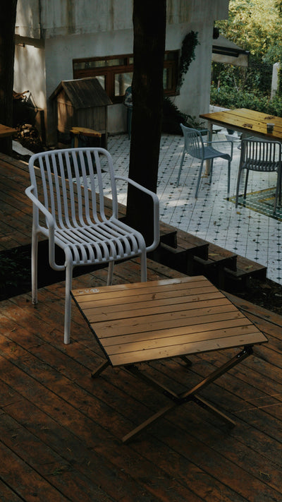 Scandinavian-inspired patio with minimalist outdoor furniture and natural materials