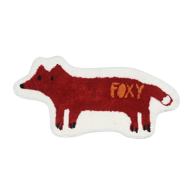 Fox non slip bathroom mat on a white wooden floor with pinecone.