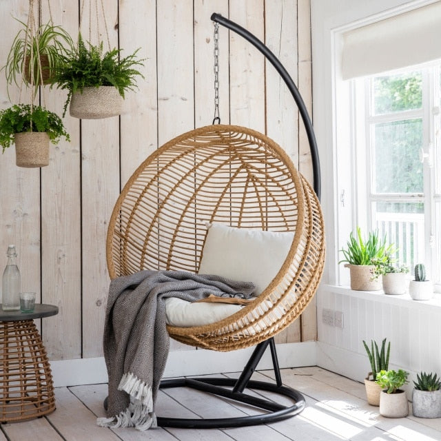 Birdnest rattan chair in a cabin.